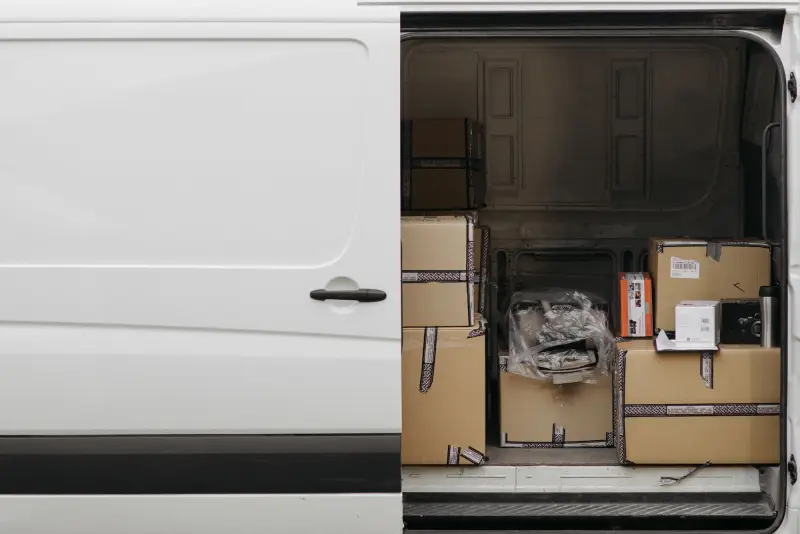 Open cargo van loaded with boxes